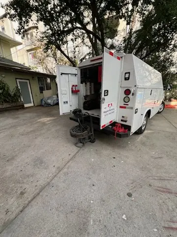 Magnet Plumbing service vehicle on-site for Grease Trap Cleaning in Collier